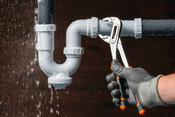 Professional Burst Pipe Repair technician working in Champaign, IL